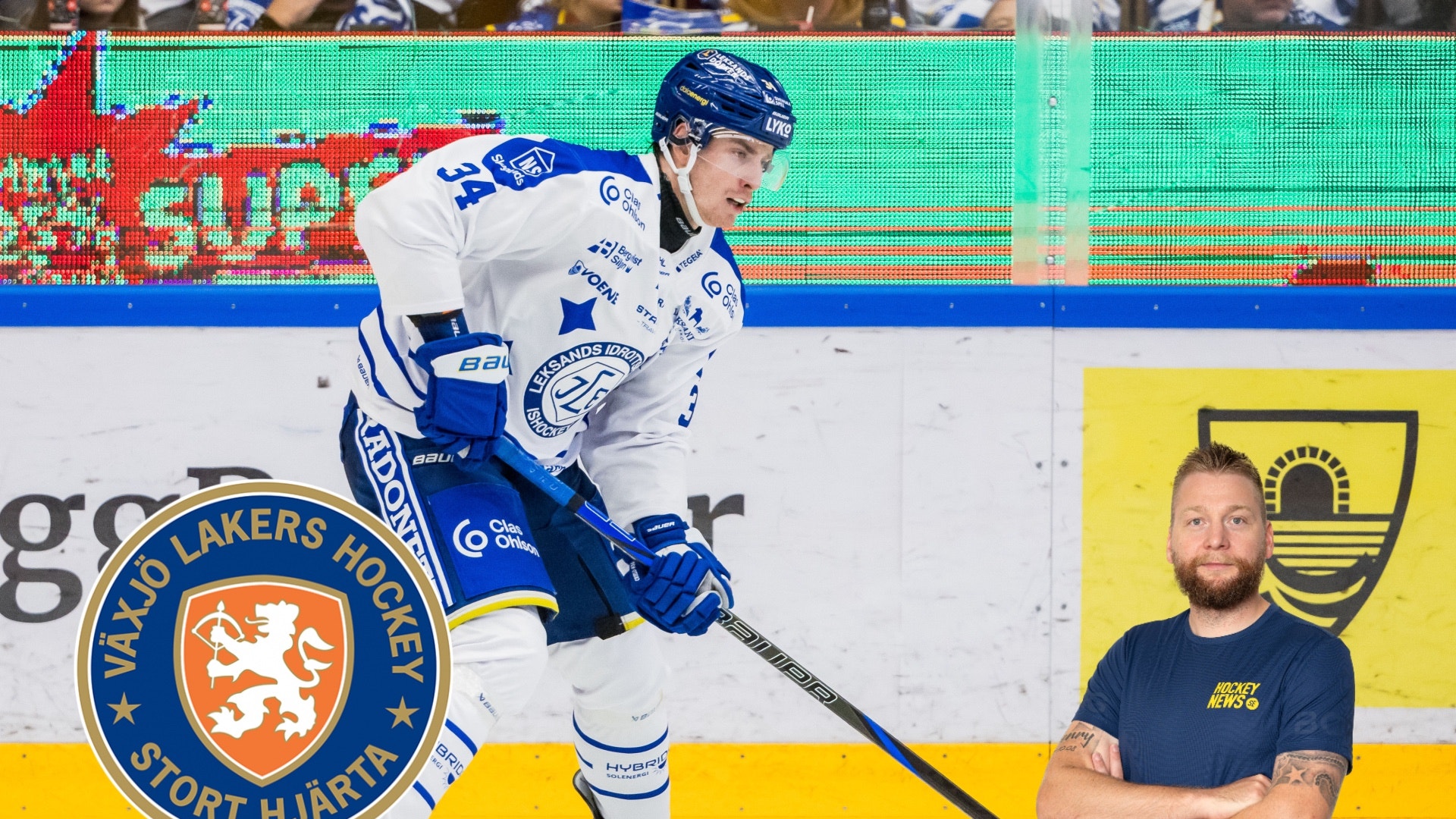 Ishockeyspelare i blå och vit träningsdräkt med hockeyklubb på isen tillsammans med en man i mörkblå skjorta.