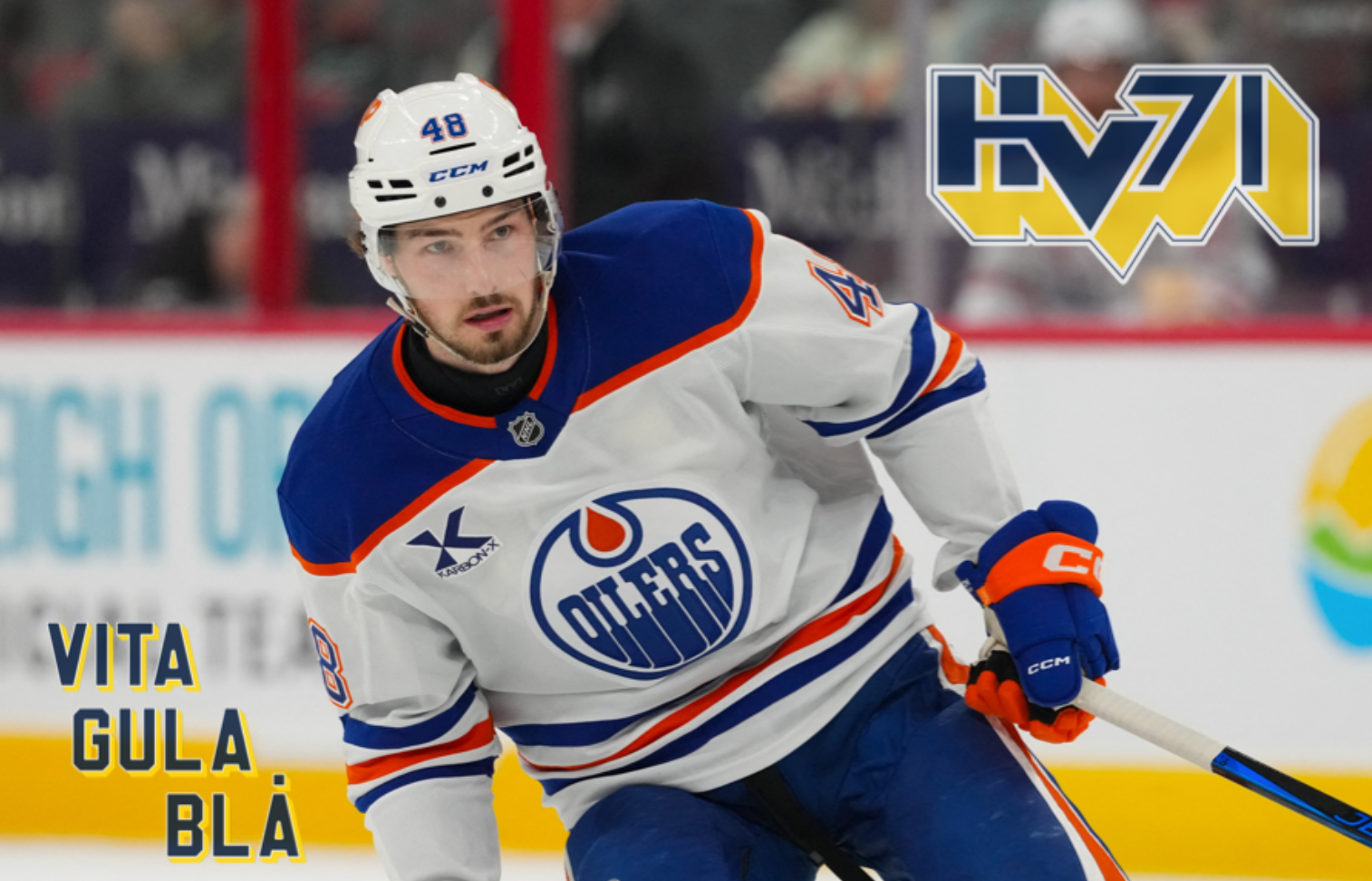 Hockeyspelar i Edmonton Oilers blå och vit uniform med nummer 48 på isen under en match.
