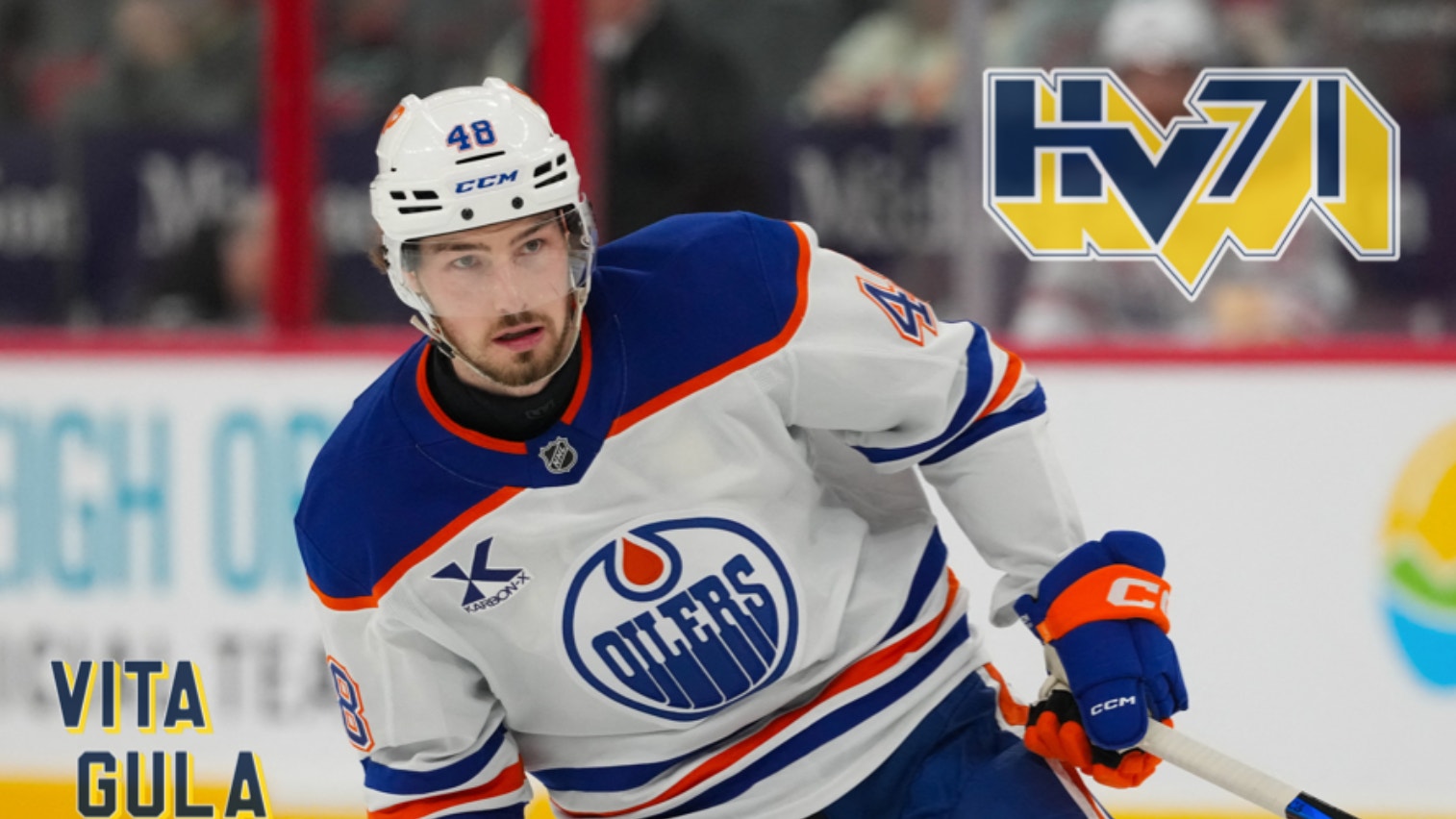 Hockeyspelar i Edmonton Oilers blå och vit uniform med nummer 48 på isen under en match.