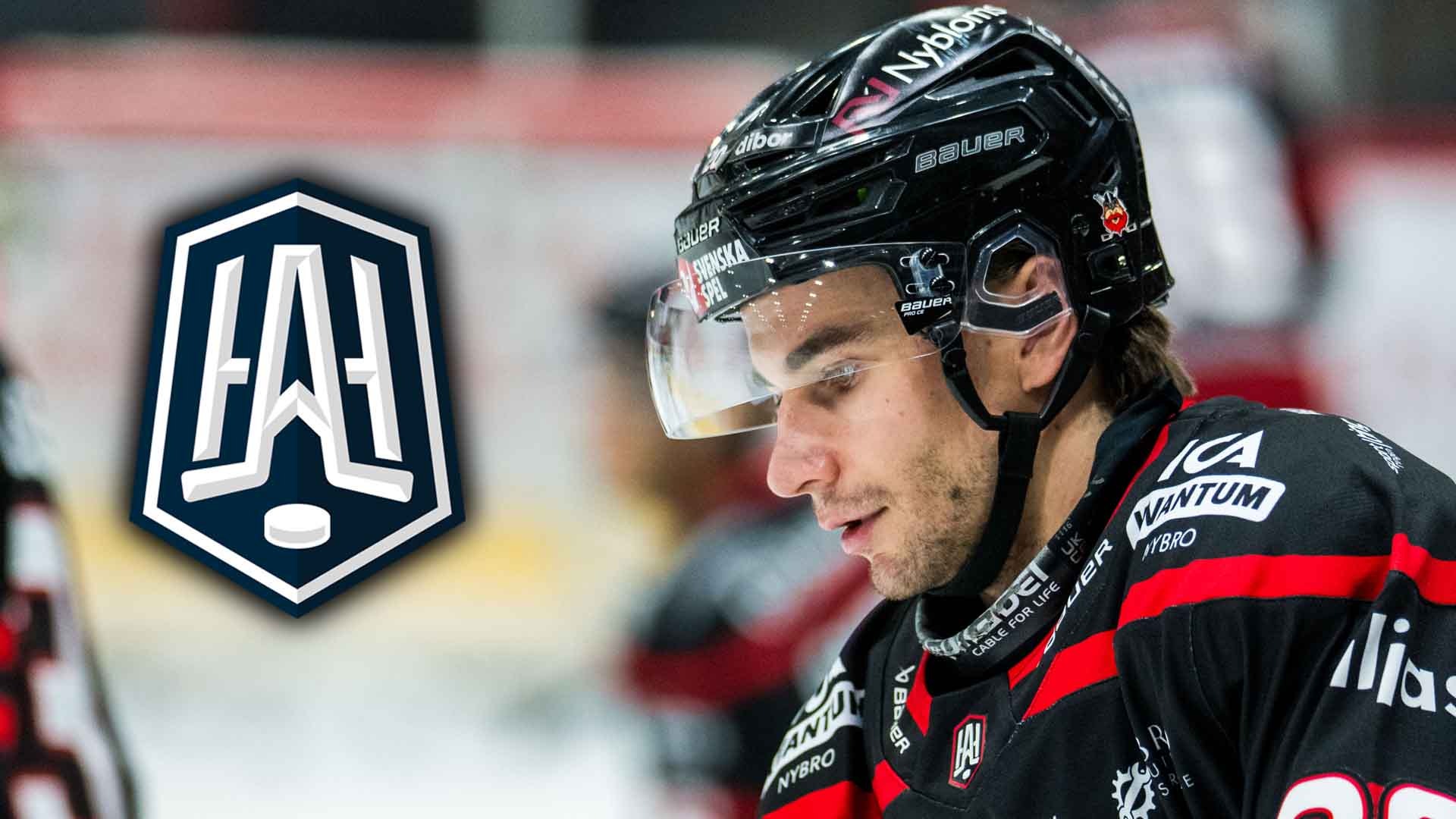 Ishockeyspelare i svart och röd tröja med hjälm och visir under en ishockeymatch.