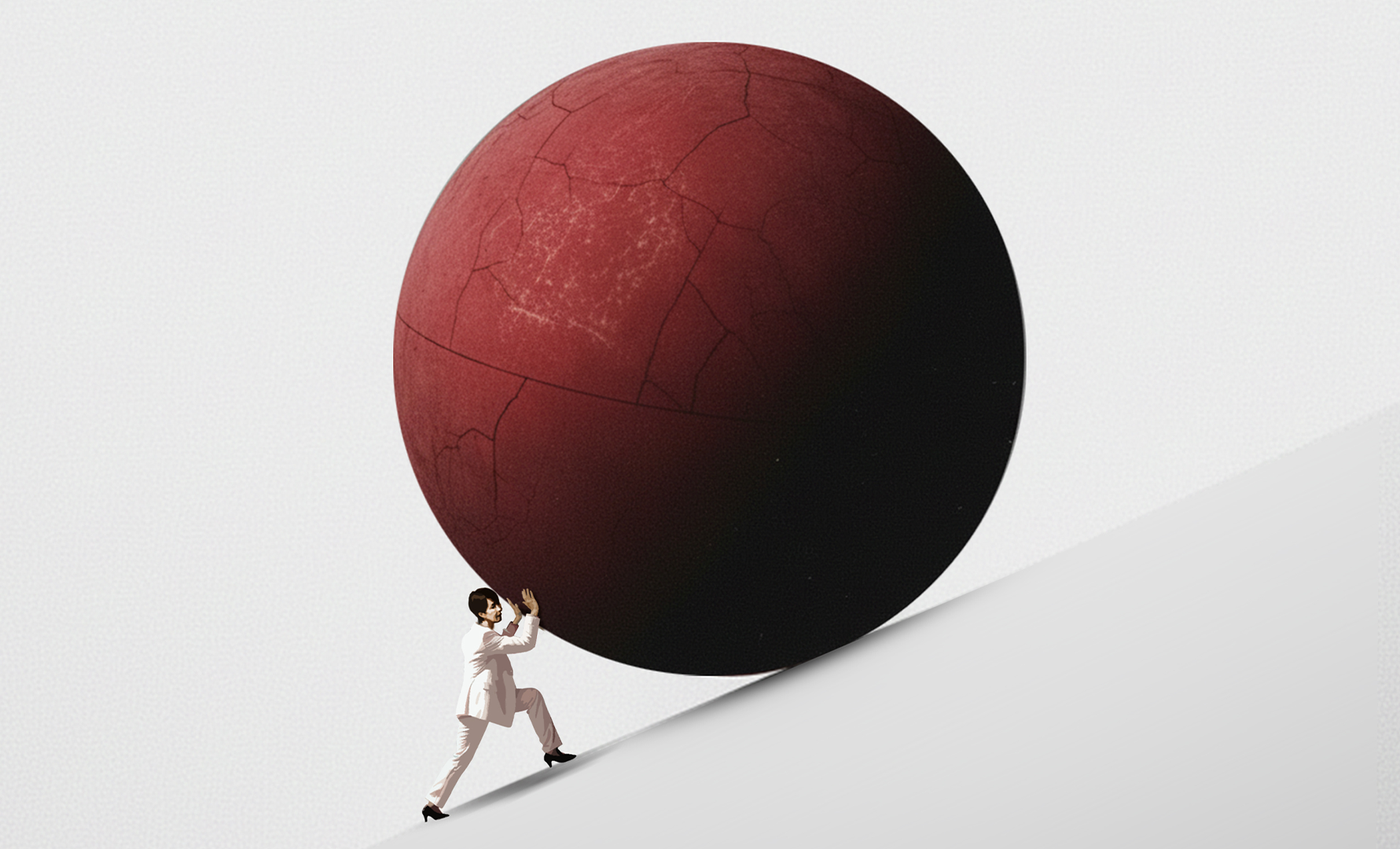 Person som skjuter en stor röd sfär uppför en lutning