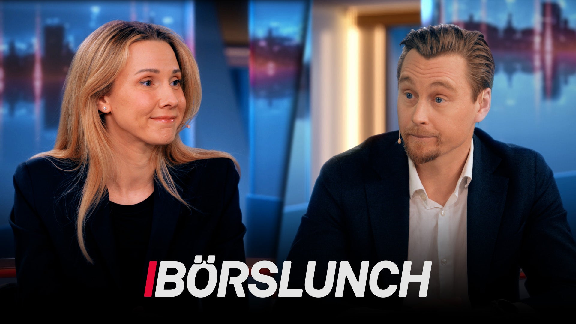 Två personer i professionell miljö framför stadshorisont, från TV-programmet Börslunch