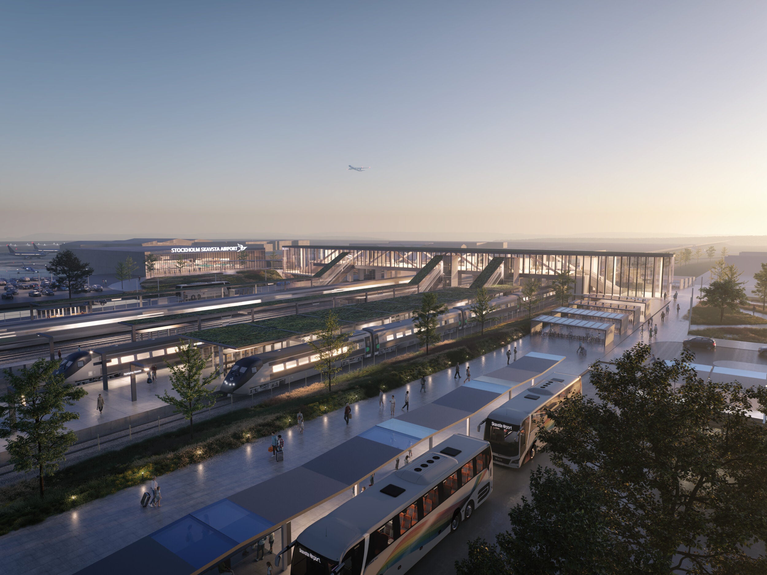 Arkitektskiss av en flygplatsterminal i skymning, med tåg och bussar som ansluter till byggnaden.